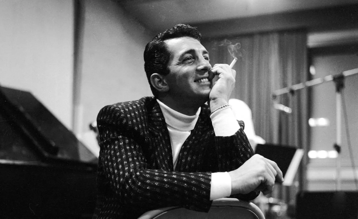 Frank Sinatra in a recording session, singing into a hanging Capitol Records microphone